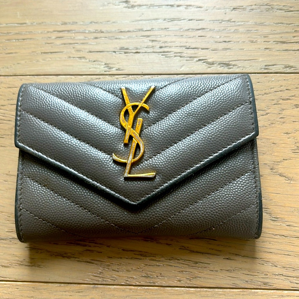 YSL envelope quilted-leather wallet. Heavy wear on the leather and hardware